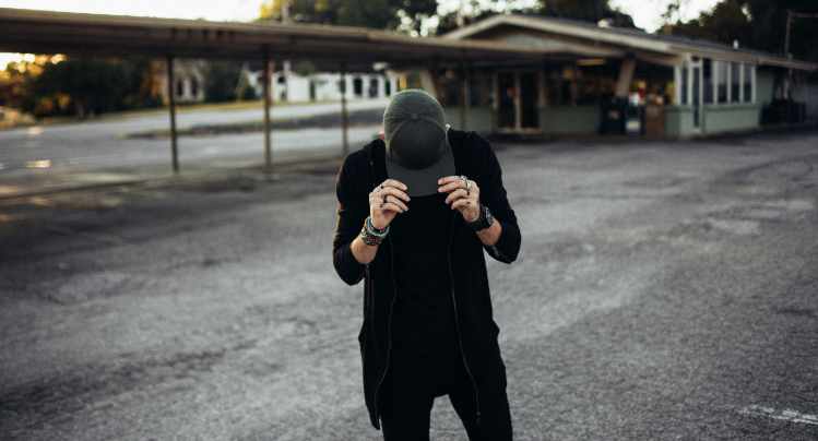 A Man Wearing Black Jeans with a Black Shirt