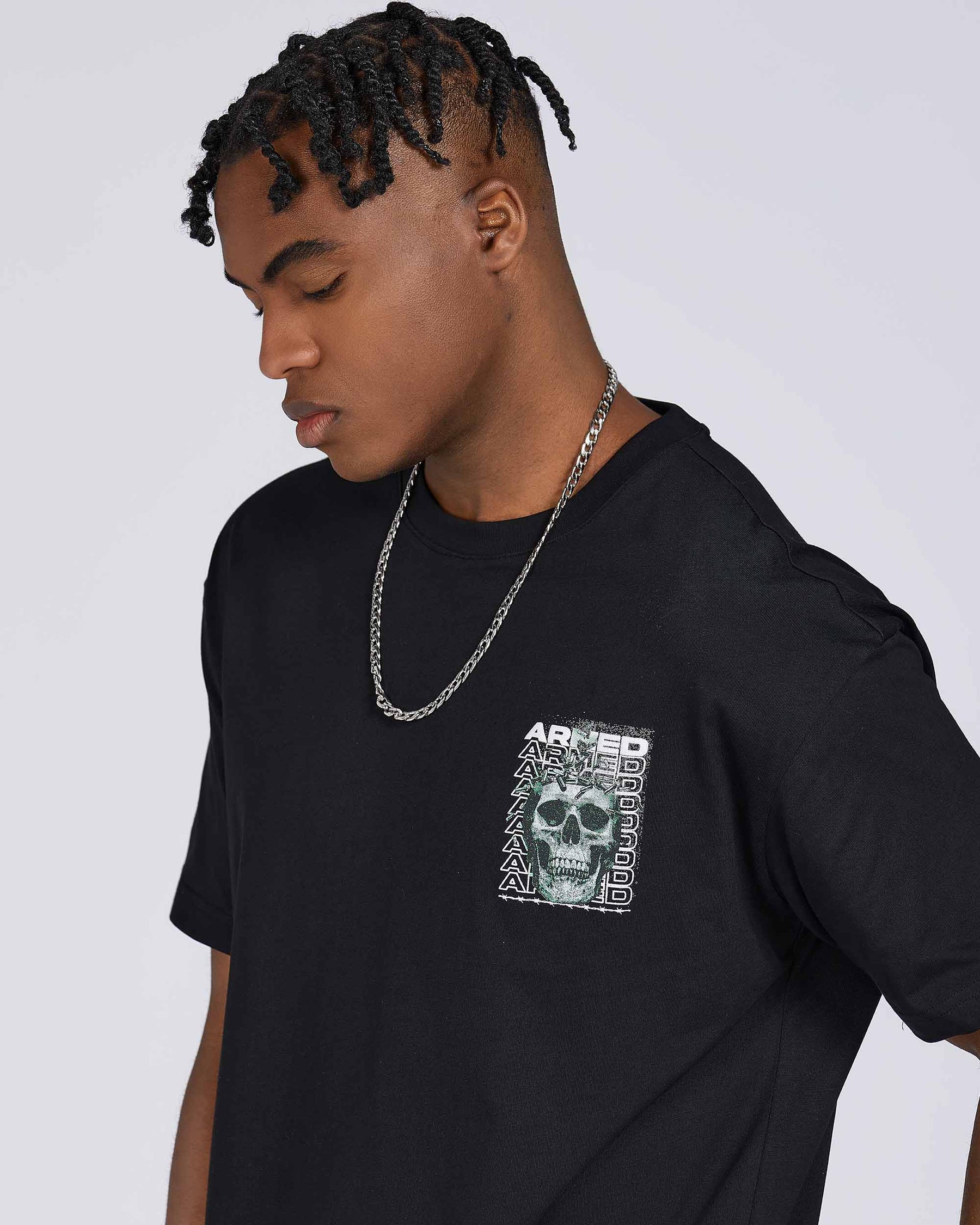T-Shirts with Green Skull Graphic, Repeated "ARMED" Letters, and Bullet