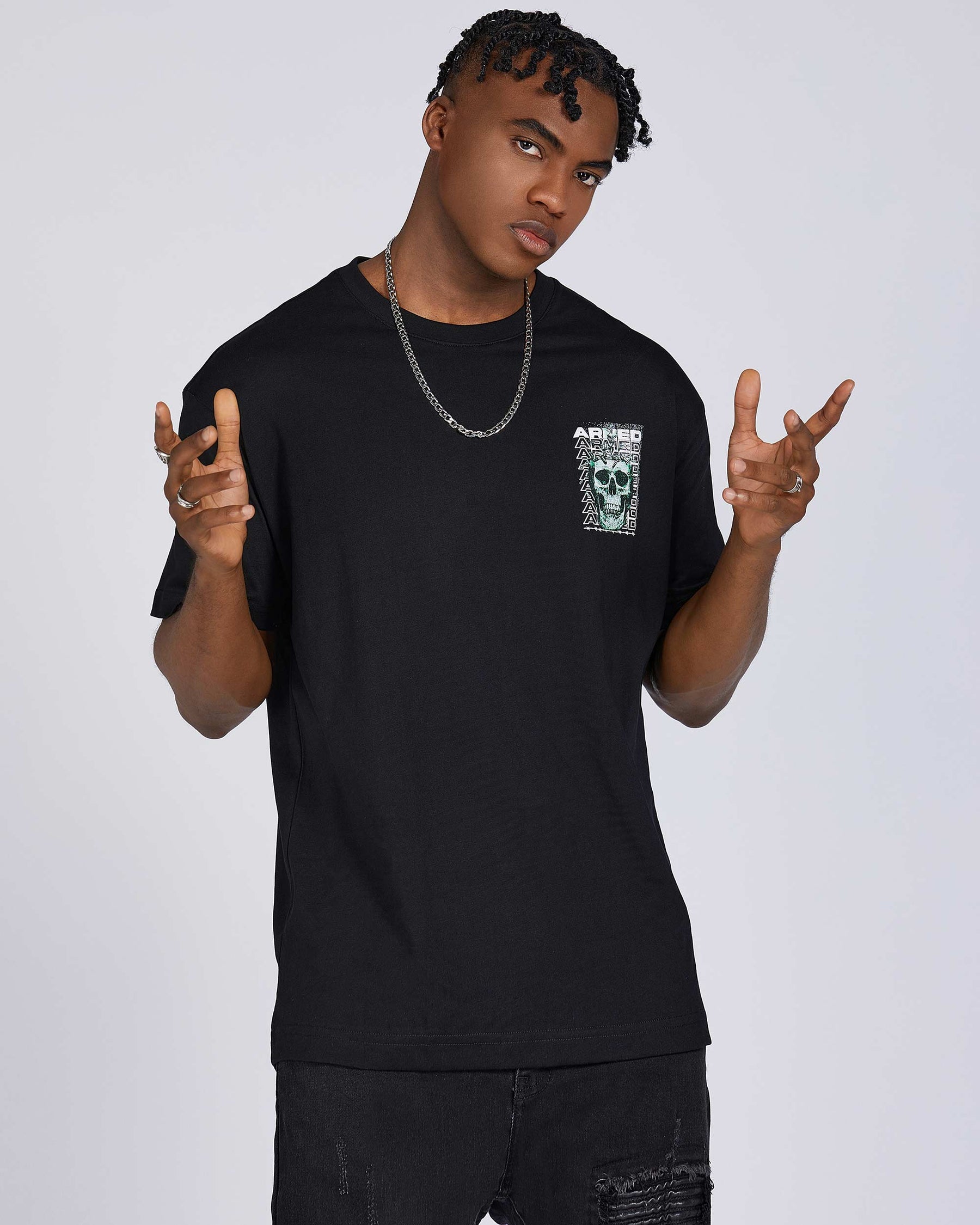 T-Shirts with Green Skull Graphic, Repeated "ARMED" Letters, and Bullet