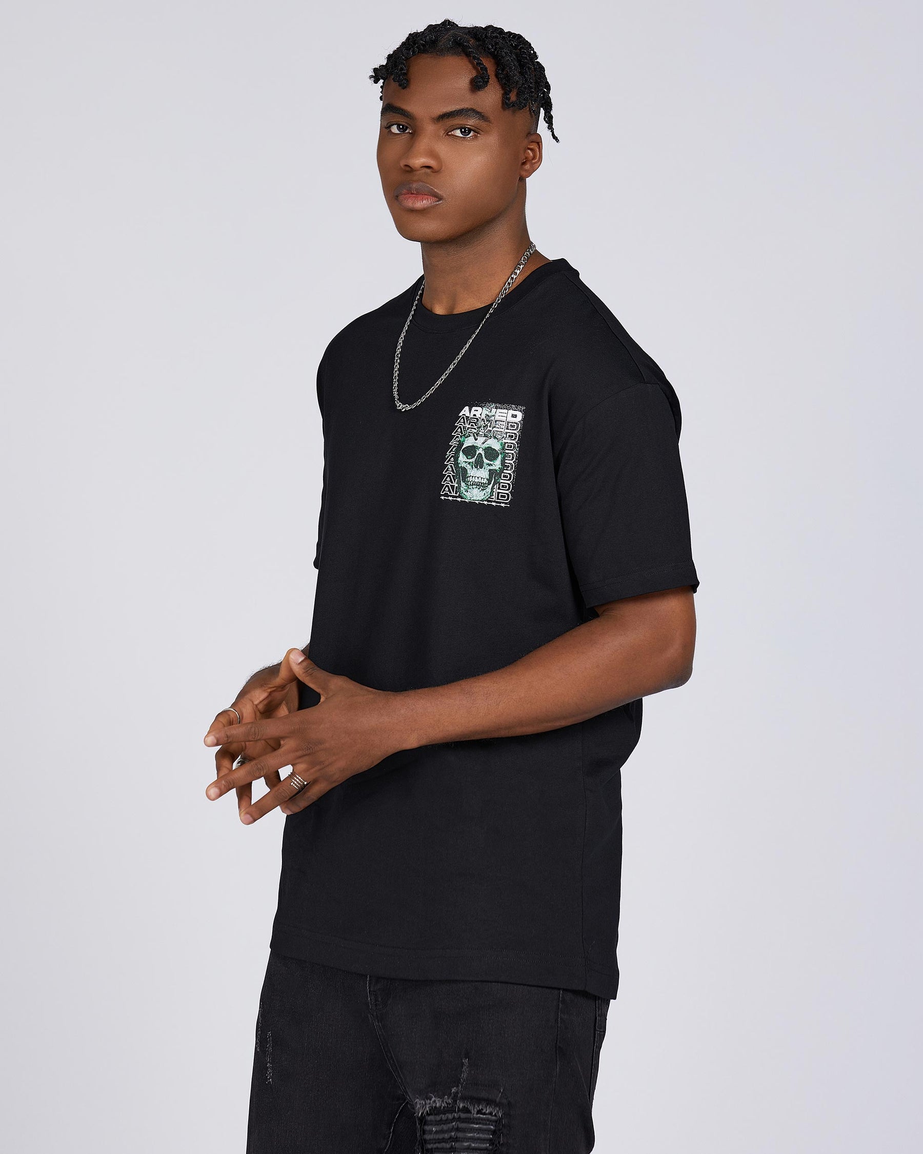 T-Shirts with Green Skull Graphic, Repeated "ARMED" Letters, and Bullet