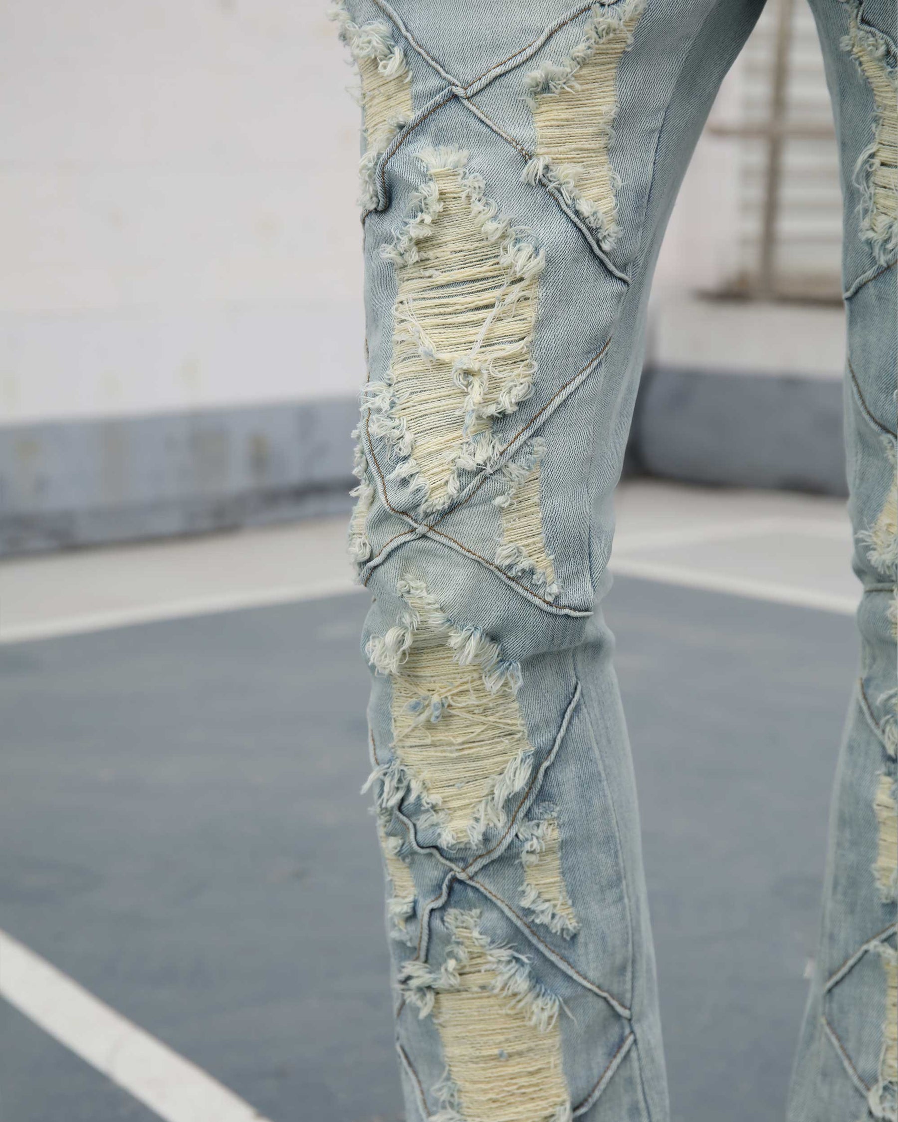 Flared Blue Jeans with Distressed and Large Ripped Detail