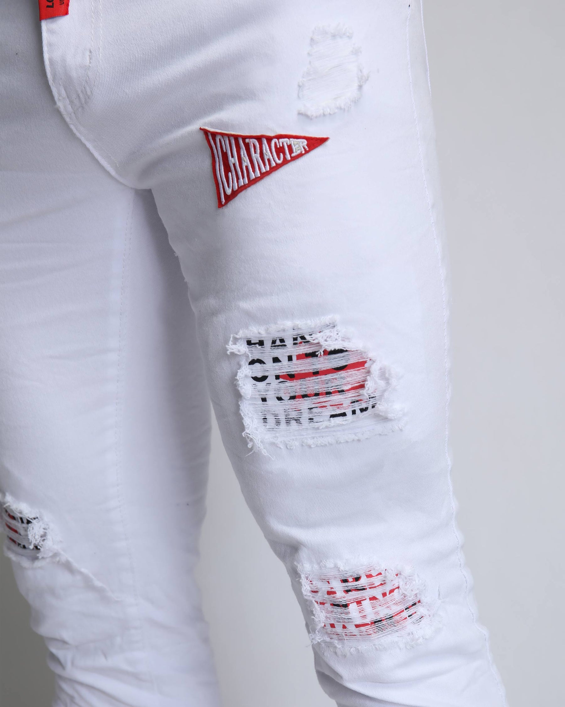 Trendy White Ripped Jeans with Badge