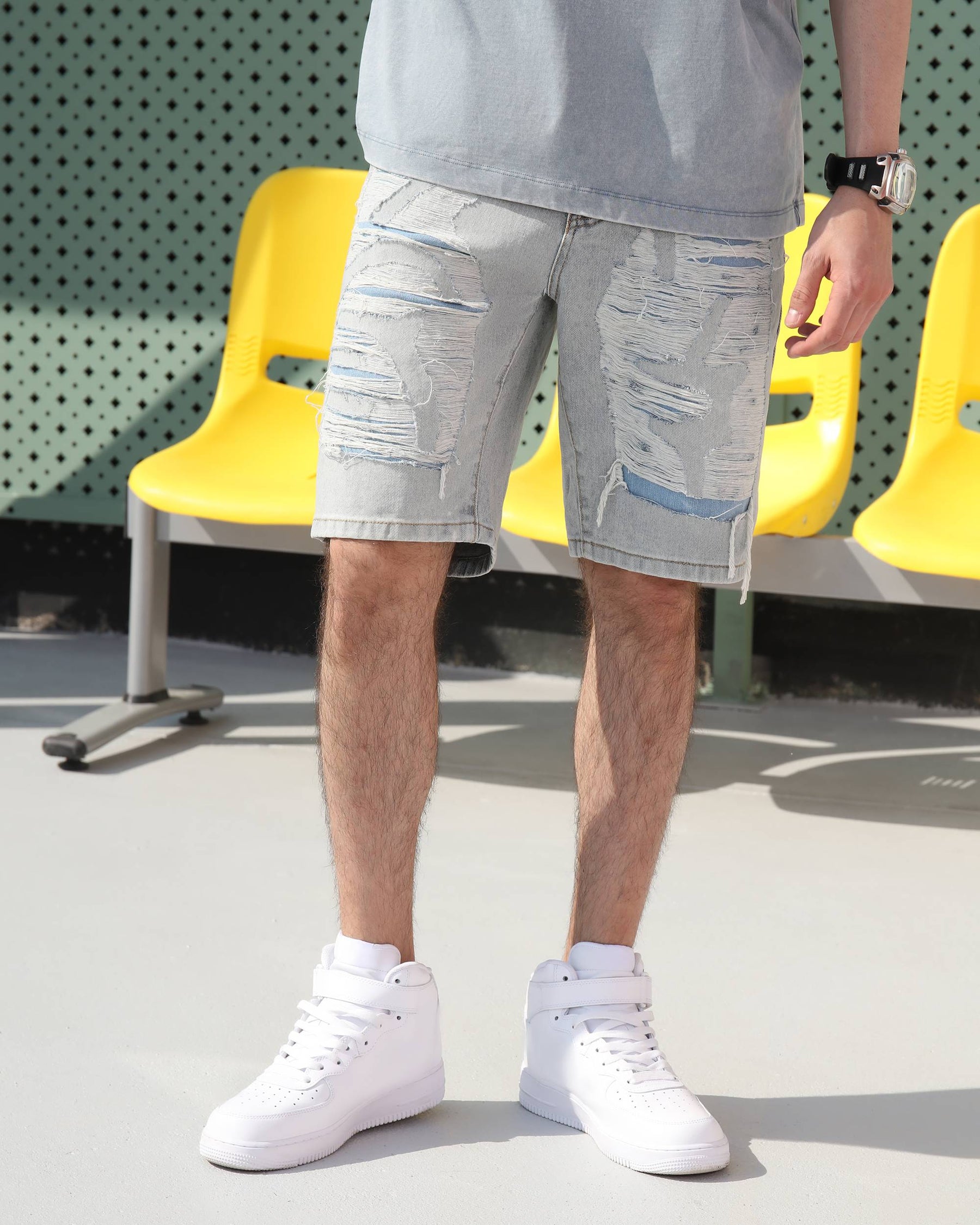 Wearing LOGEQI's light blue distressed denim cargo shorts with frays and rips