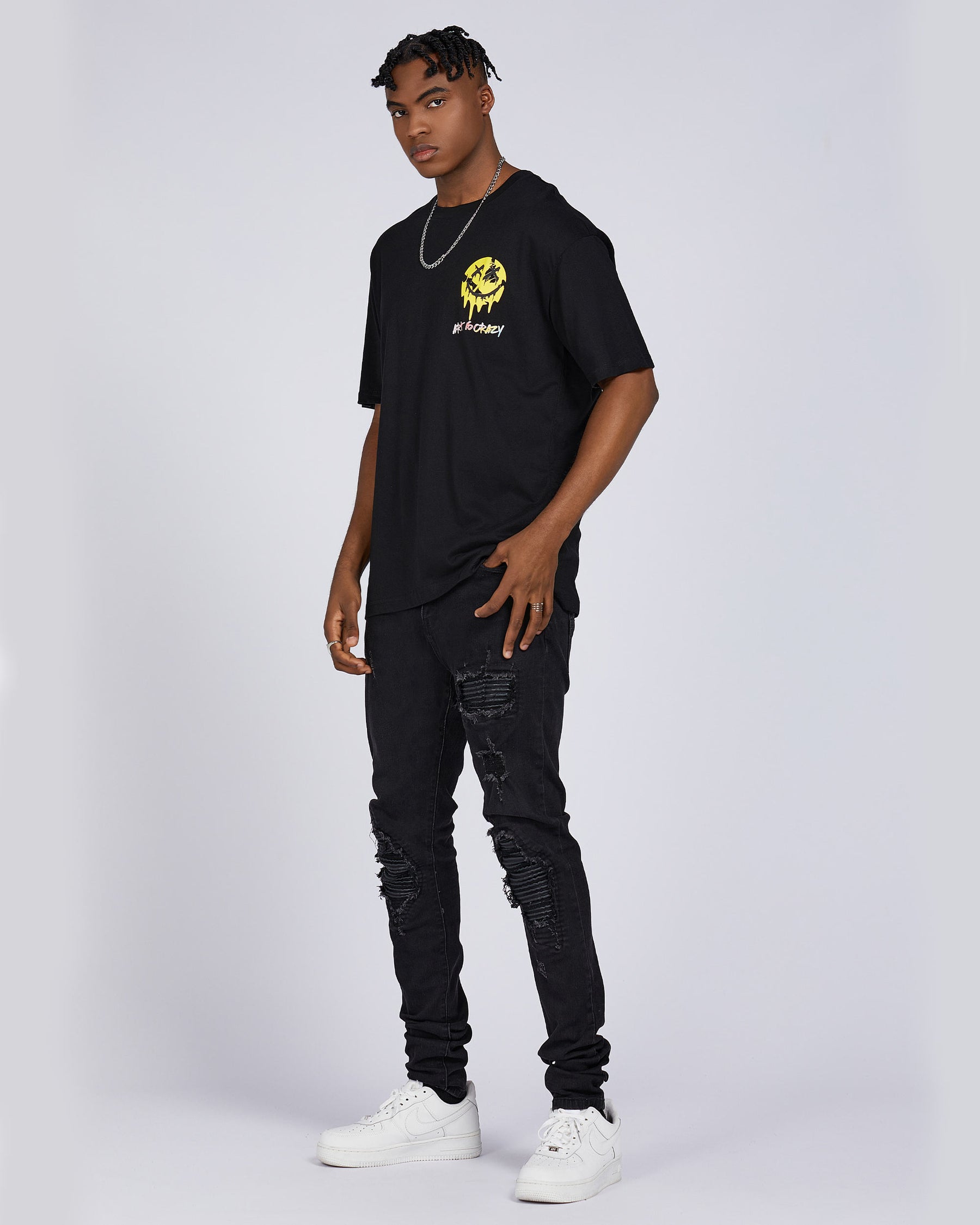 Camiseta con gráfico de cara sonriente derretida, tipografía y cita