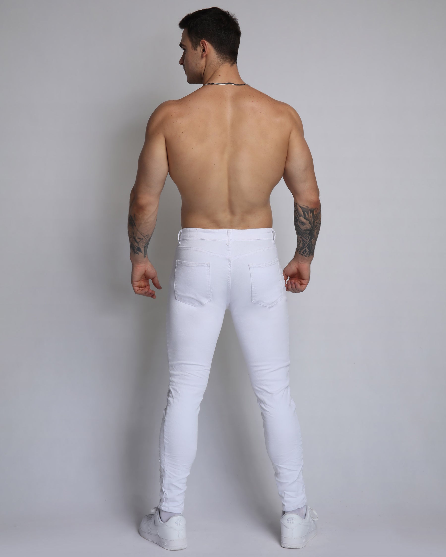 Trendy White Ripped Jeans with Badge