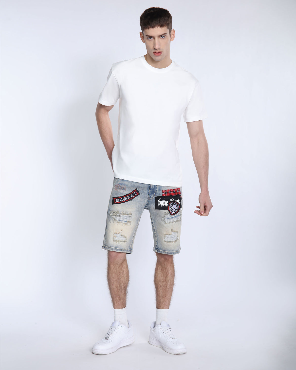 Distressed Denim Shorts with Gothic Skull Badge