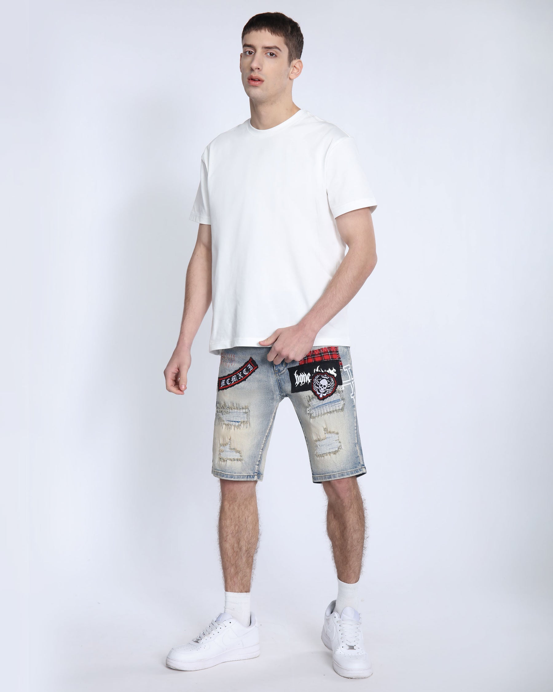 Distressed Denim Shorts with Gothic Skull Badge
