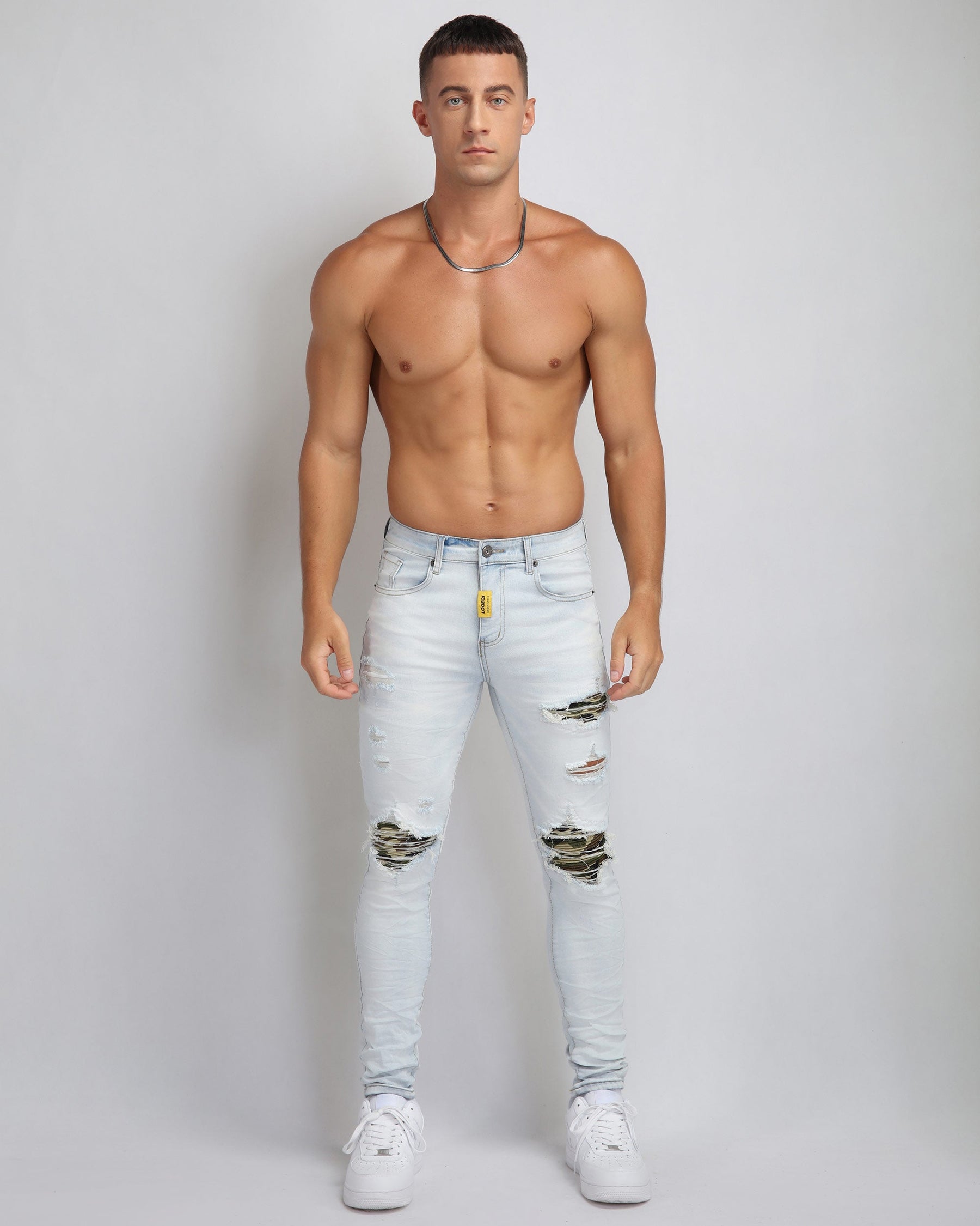 Light Wash Ripped Blue Jeans with Camouflage Patch