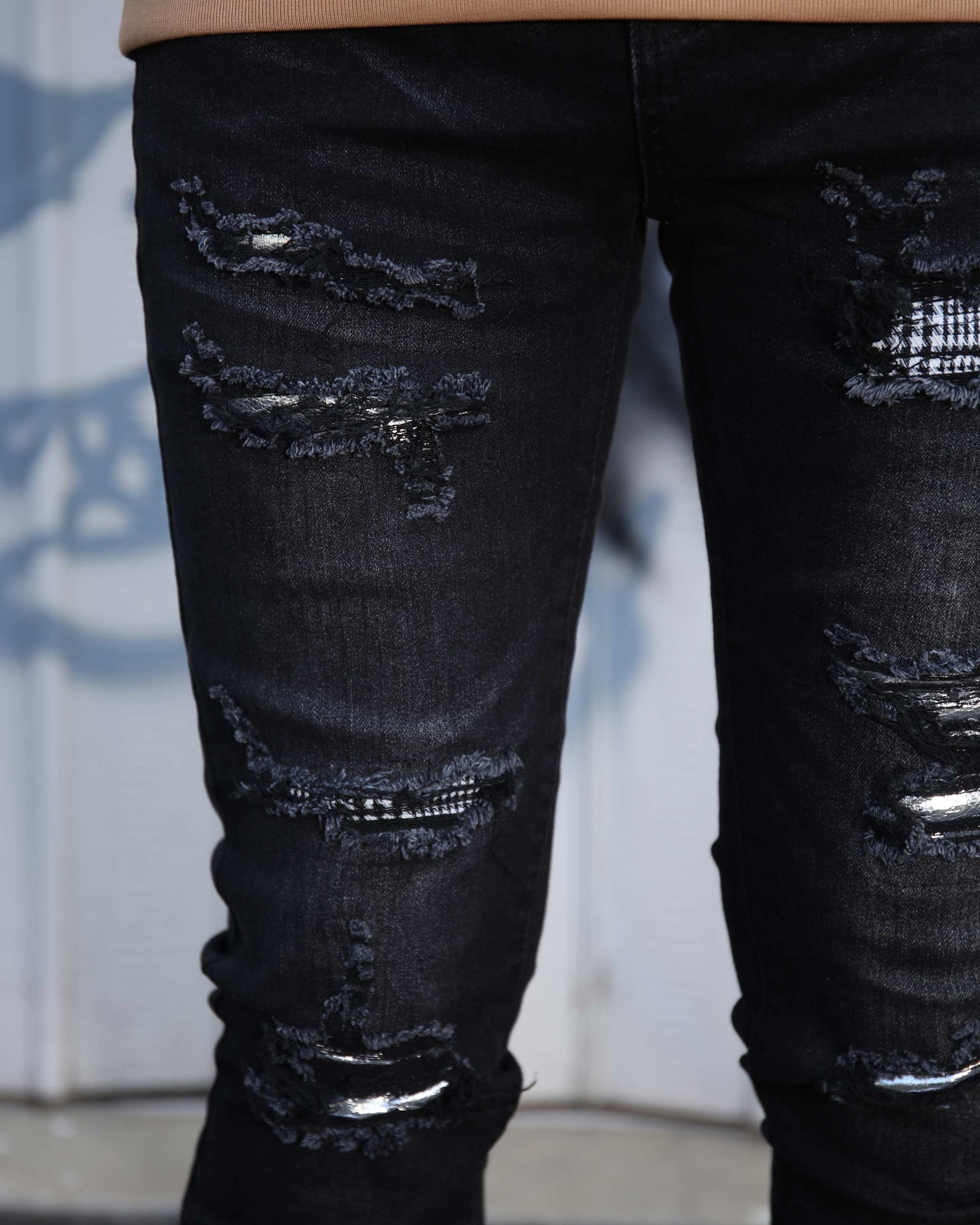 LOGEQI Black Ripped Jeans with Bold Rips and Plaid Patch