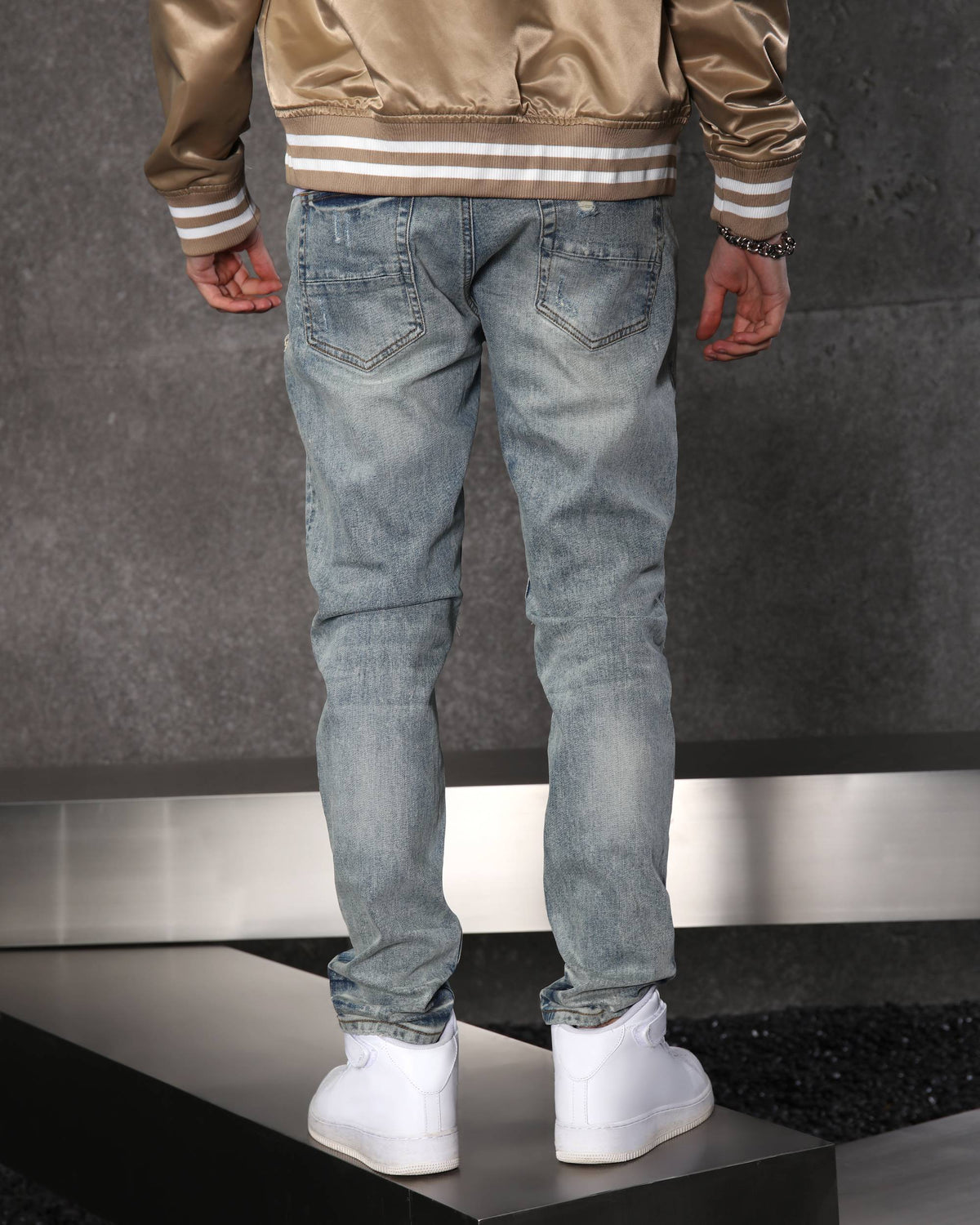 Unique Men’s Light Blue Ripped Jeans with Checkered Patches