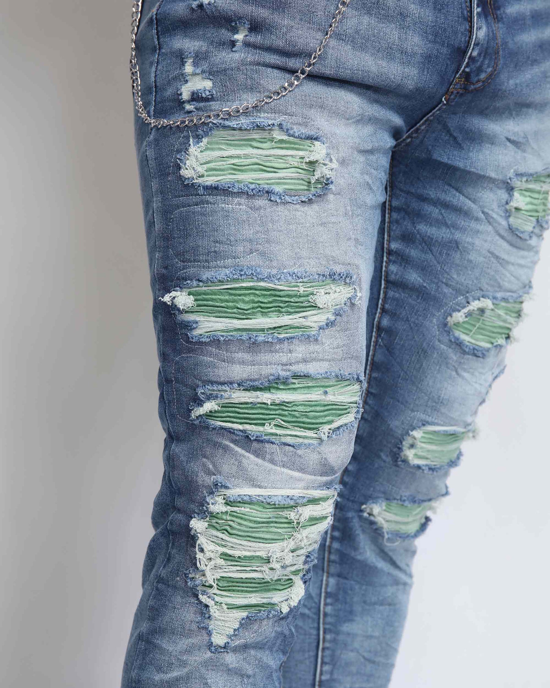 Large Ripped Blue Jeans with Green Patches