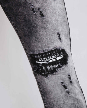 Irregular Wash Ripped Black Jeans with Black Patches