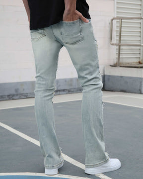 Flared Blue Jeans with Distressed and Large Ripped Detail
