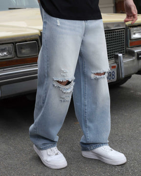 Show the detailed view of LOGEQI's blue knee-ripped baggy jeans for men