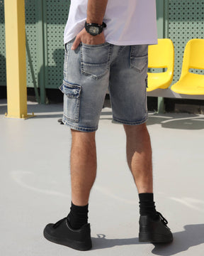 Showing the sleek-looking detail of the back pocket of LOGEQI's blue denim cargo shorts.