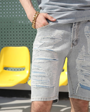 Showing the front pockets of LOGEQI's distressed light blue denim shorts for men