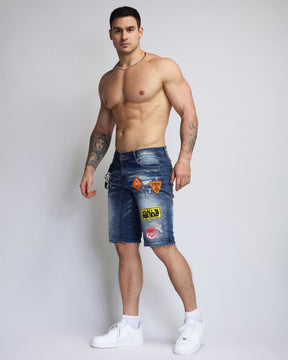 Ripped Blue Denim Shorts with Personality Badge in Medium Wash