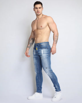 Spray Paint Ripped Blue Jeans with Medium Wash