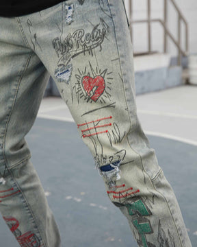 Graffiti & Graphics Slim-Fit Ripped Blue Light Wash Jeans for Streetwear