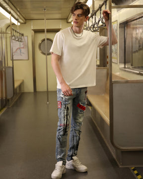 Logeqi Medium Wash Blue Ripped Jeans with Gothic Flair