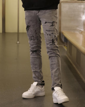 LOGEQI Gray Ripped Jeans with Graffiti-Inspired Style