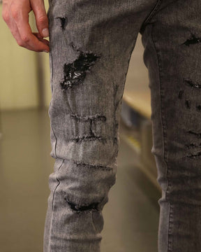 LOGEQI Gray Ripped Jeans with Graffiti-Inspired Style