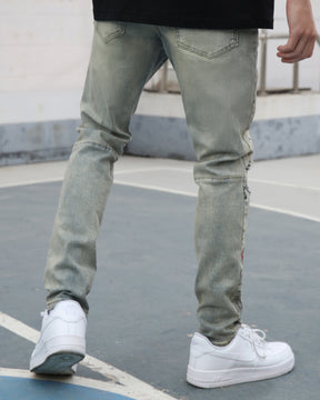 Graffiti & Graphics Slim-Fit Ripped Blue Light Wash Jeans for Streetwear