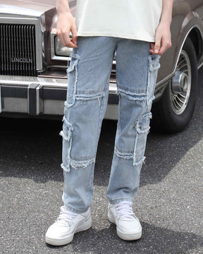 A man styling LOGEQI's men's fringed edge, ripped, distressed baggy jeans with a white T-shirt and white sneakers, with a car in the background 