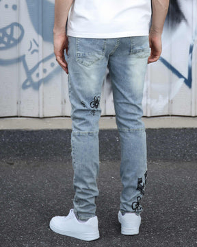 Logeqi Street Art Light Wash Blue Jeans Adorned with Painted Graffiti