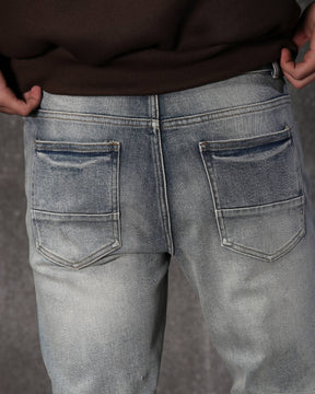 Vaqueros ajustados con parches rotos y lavado claro para hombre