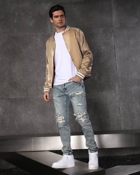 Vaqueros rotos azul claro con parches de cuadros para hombre