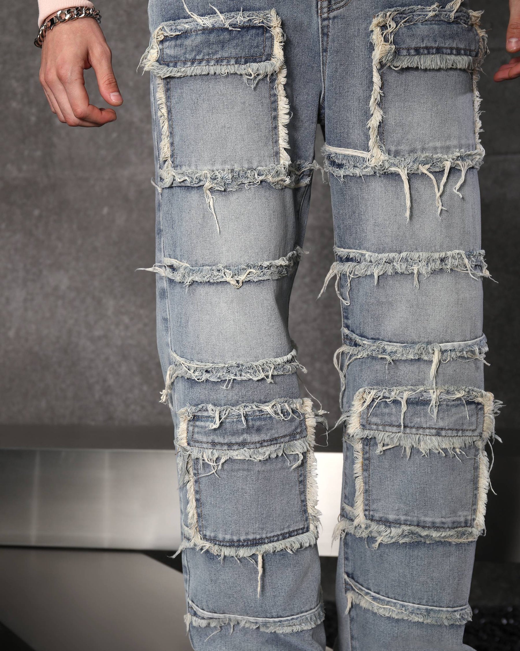 Eye-Catching Men’s Blue Heavily Distressed Patchwork Jeans
