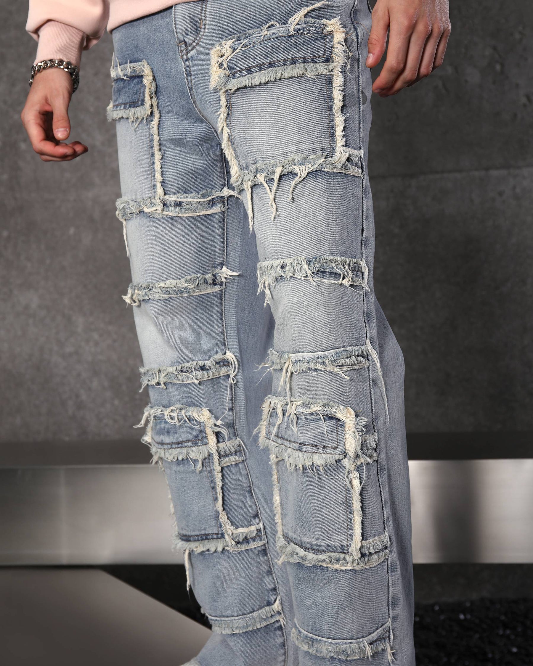 Eye-Catching Men’s Blue Heavily Distressed Patchwork Jeans